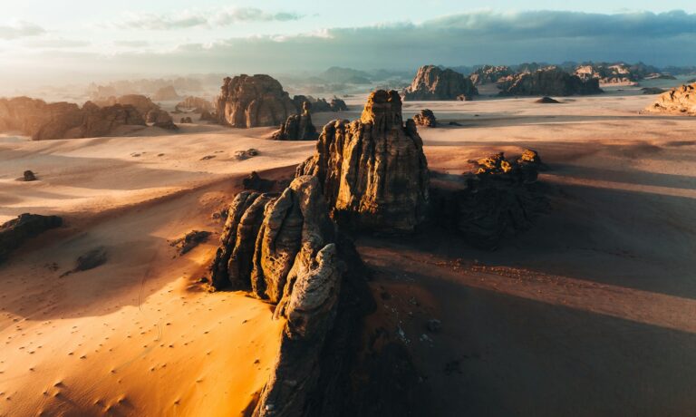 Photo by NEOM a desert landscape with rocks and sand