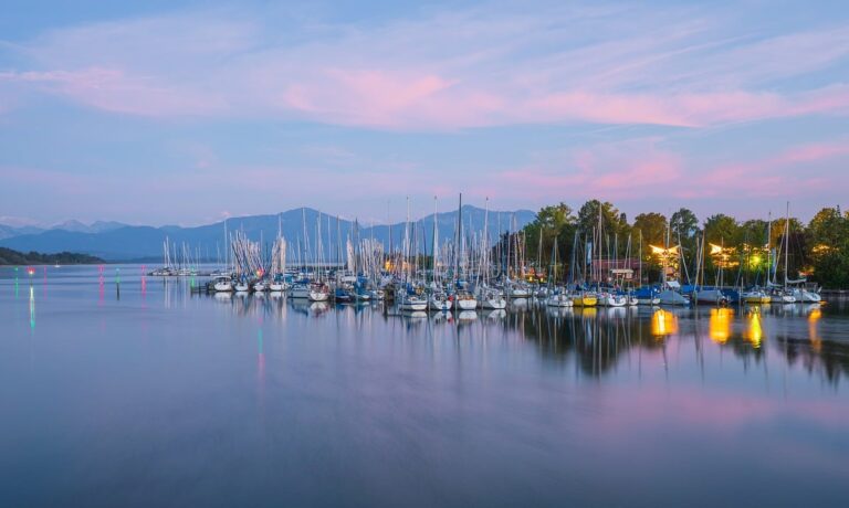 Photo by ChiemSeherin sunrise, dusk, morning light, lake, water, nature, reflection, clouds, the atmosphere, boat harbour, boats, port, chiemsee, bavaria