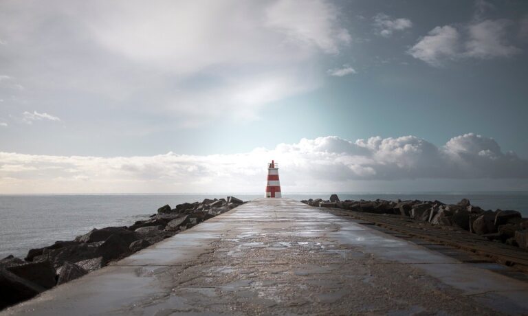 lighthouse, pier, atlantic ocean, portugal, coastline, seascape, jetty, walkway, wet pavement, nature, dramatic sky, clouds, horizon, minimalism, leading lines, symmetry, beacon, maritime, seaside, coastal, travel