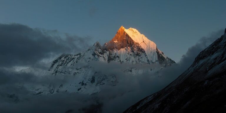 machhapuchhre, fishtail, annapurna base camp, nepal, himalayas, sunset, mountain peak, snow mountain, landscape, nature, trekking, travel, alpine, golden hour, scenery, wilderness, high altitude, steep mountain, clouds, mountaineering, natural beauty